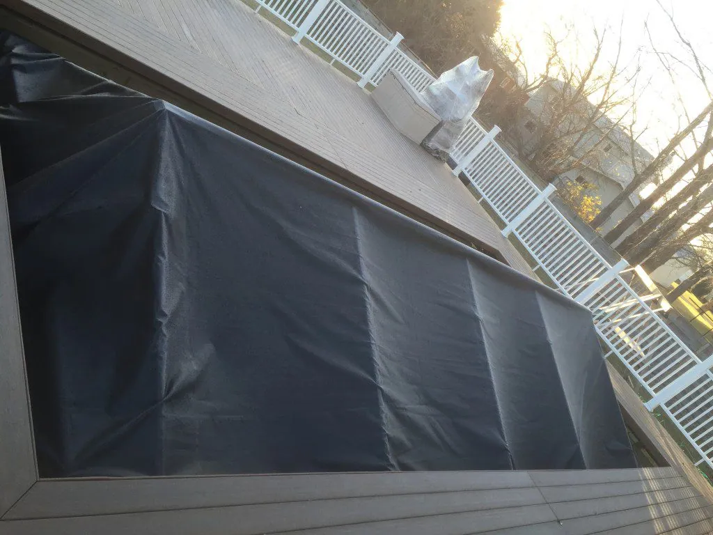 Custom cover stretched over an in-ground pool