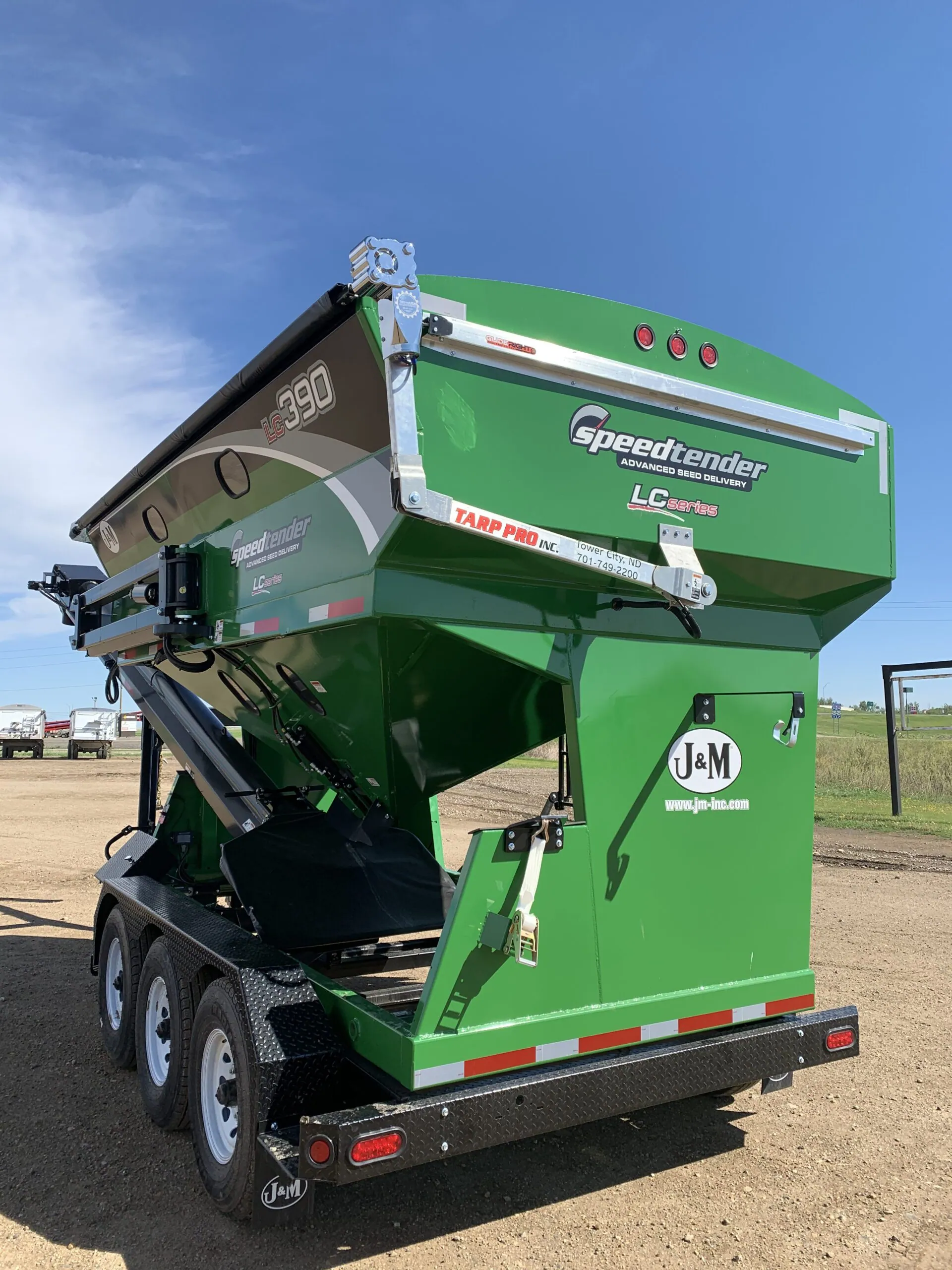 Green seed tender with an electric roll tarp